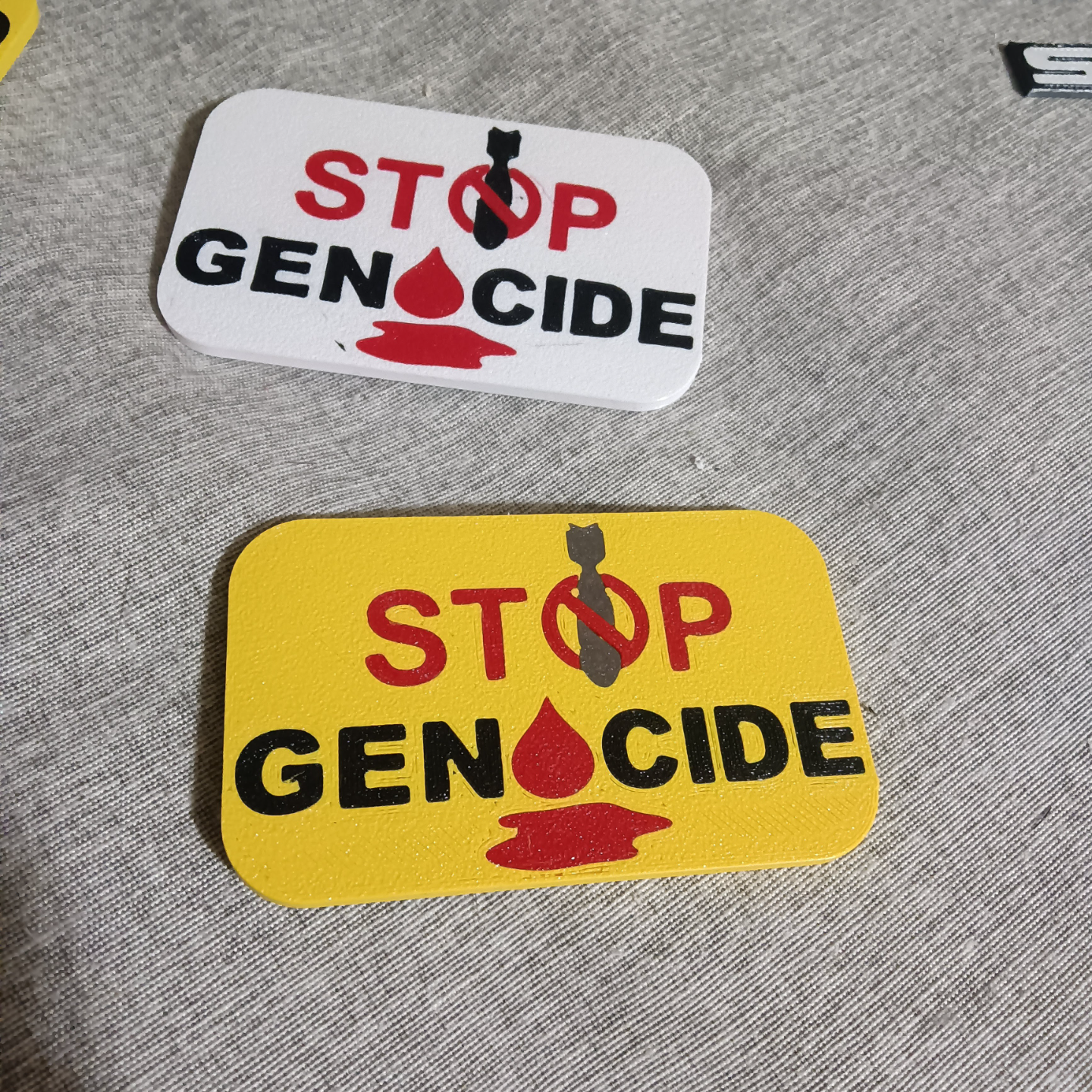 STOP GENOCIDE badge