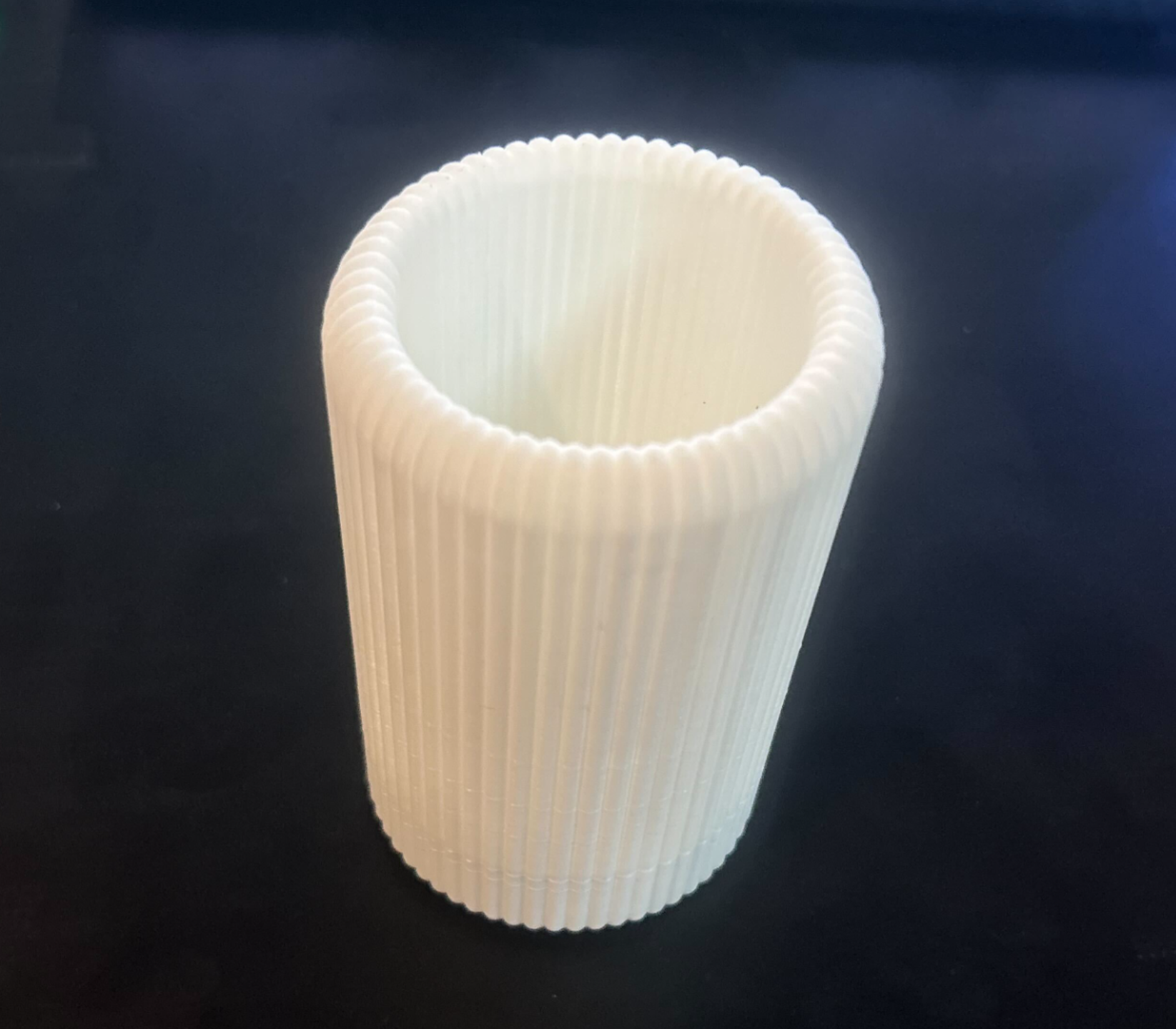 Toothbrush cup with removable bottom