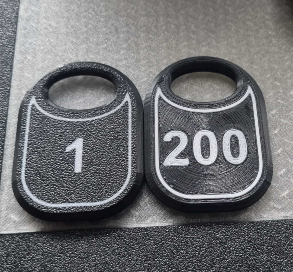 Token (number plate) for the cloakroom.