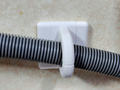 Dishwasher drain hose wall hook