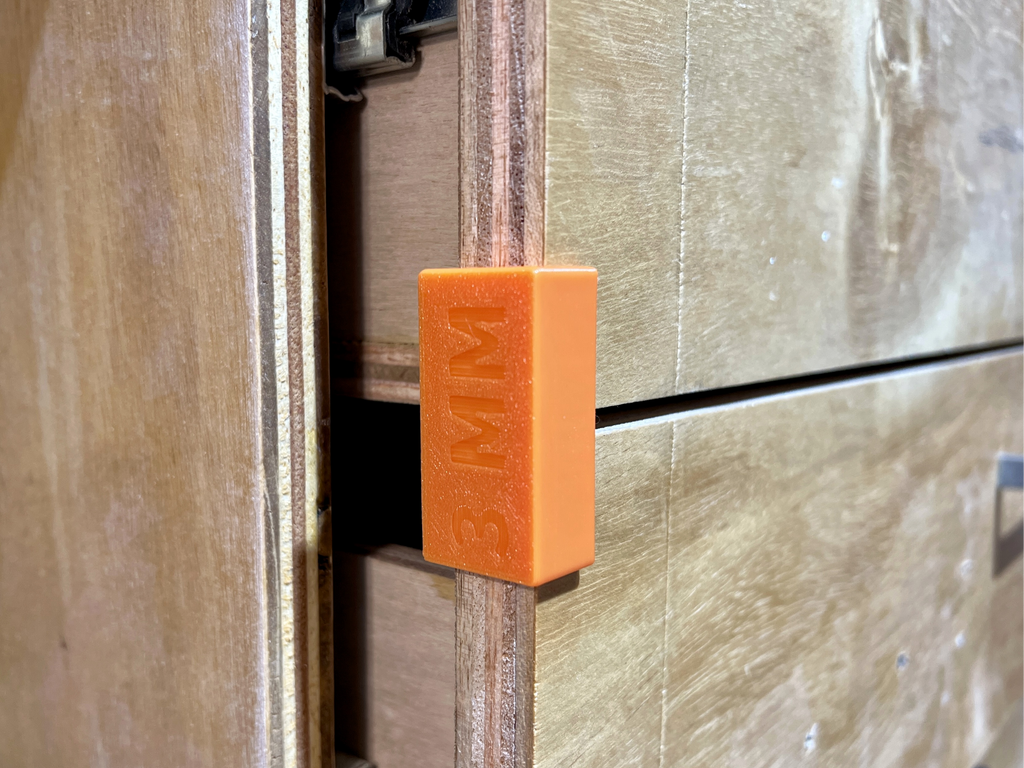 Drawer face spacer shims