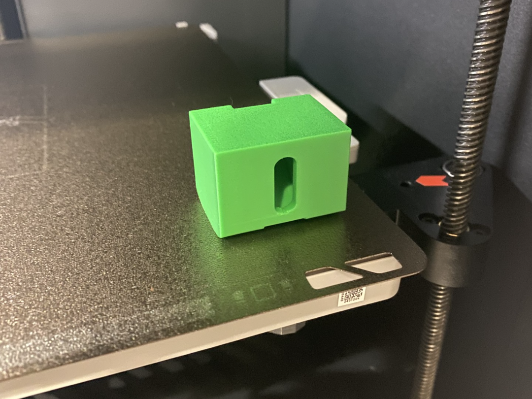 Purge filament scraper