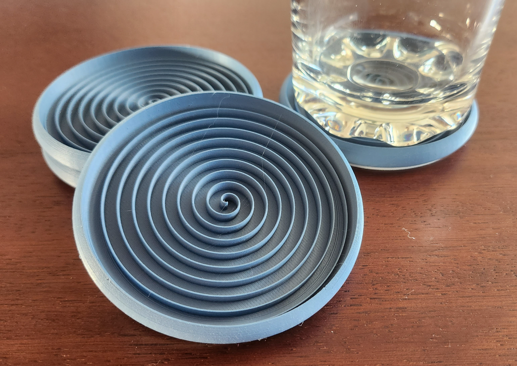 Stackable spiral coasters for glasses