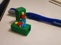 Mini figure toothbrush cap