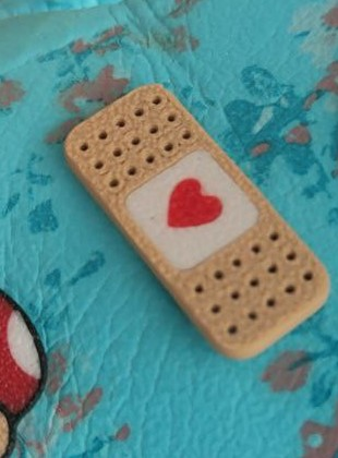 band aid crock charm