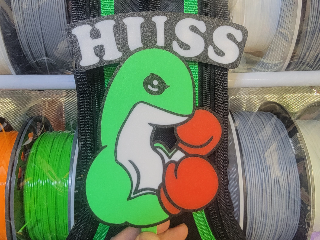 Team Huss Nessie Sign and Necklace