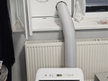 Air conditioner vent outlet with flaps