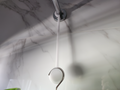 Shower caddy hanger extension