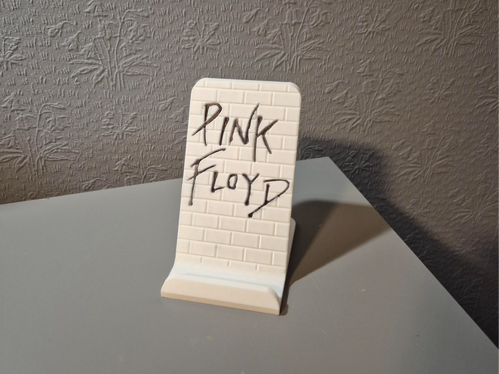 Phone stand Pink Floyd The Wall. Free to sell.
