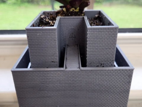 Self watering castle planter