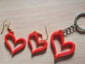 Earrings and keychain in the shape of a heart