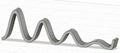 Sinusoidal laptop stand with attenuation