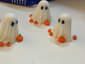 Mini Ghost for Halloween surrounded by pumpkins
