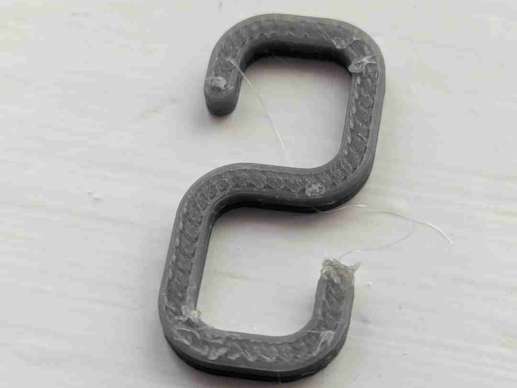 Small hook for hanging lights on net curtain rail