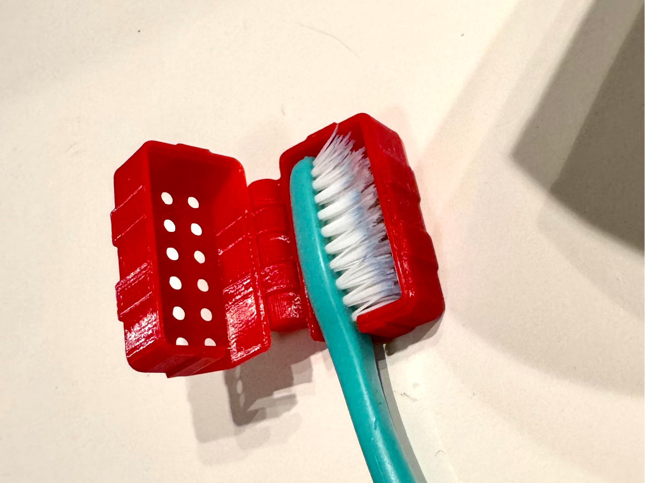Toothbrush travel case with click