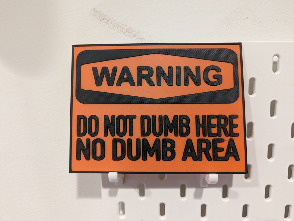 "No Dumb Area" Sign