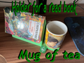Holder for a read book and a mug of tea