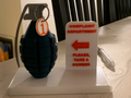 Complaint sign with toy grenade
