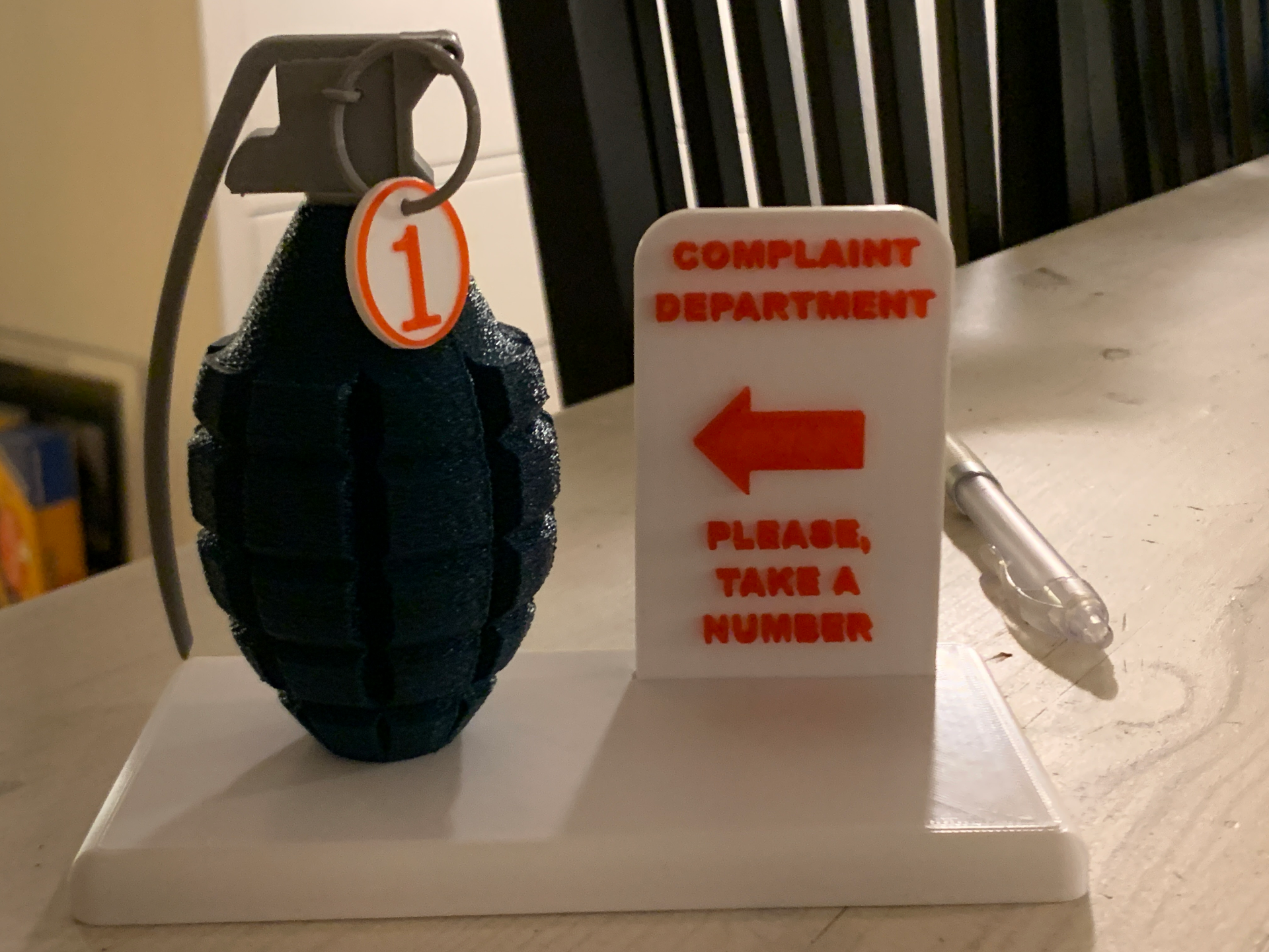 Complaint sign with toy grenade
