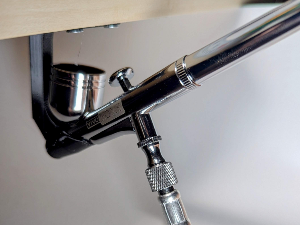 Under shelf airbrush holder