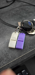 Extremely loud and compact emergency whistle