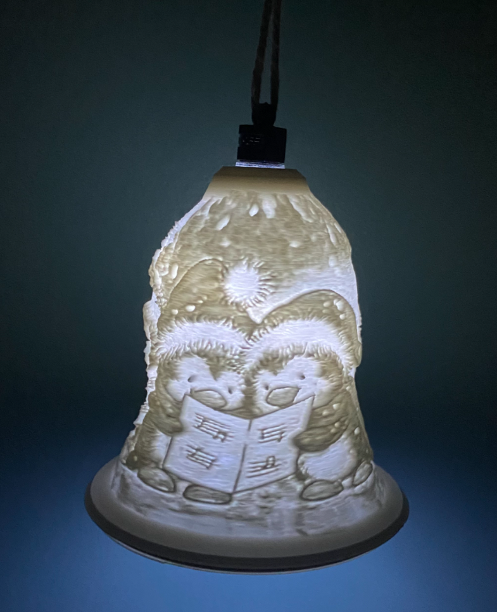 penguins singing christmas bell