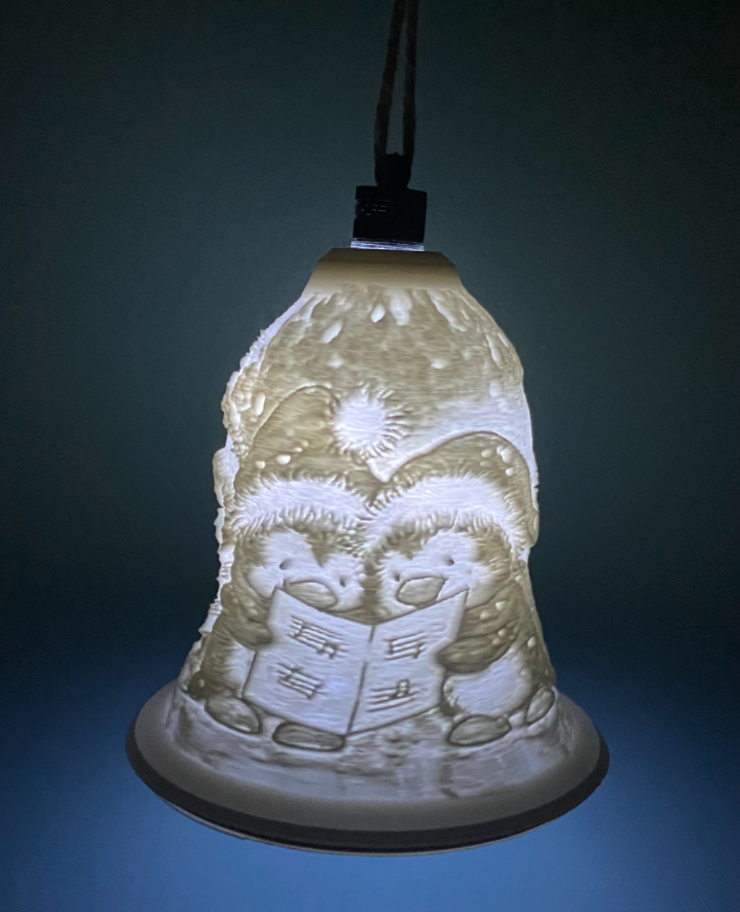penguins singing christmas bell