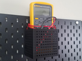 Skadis Large Container holds Fluke 87V Multimeter