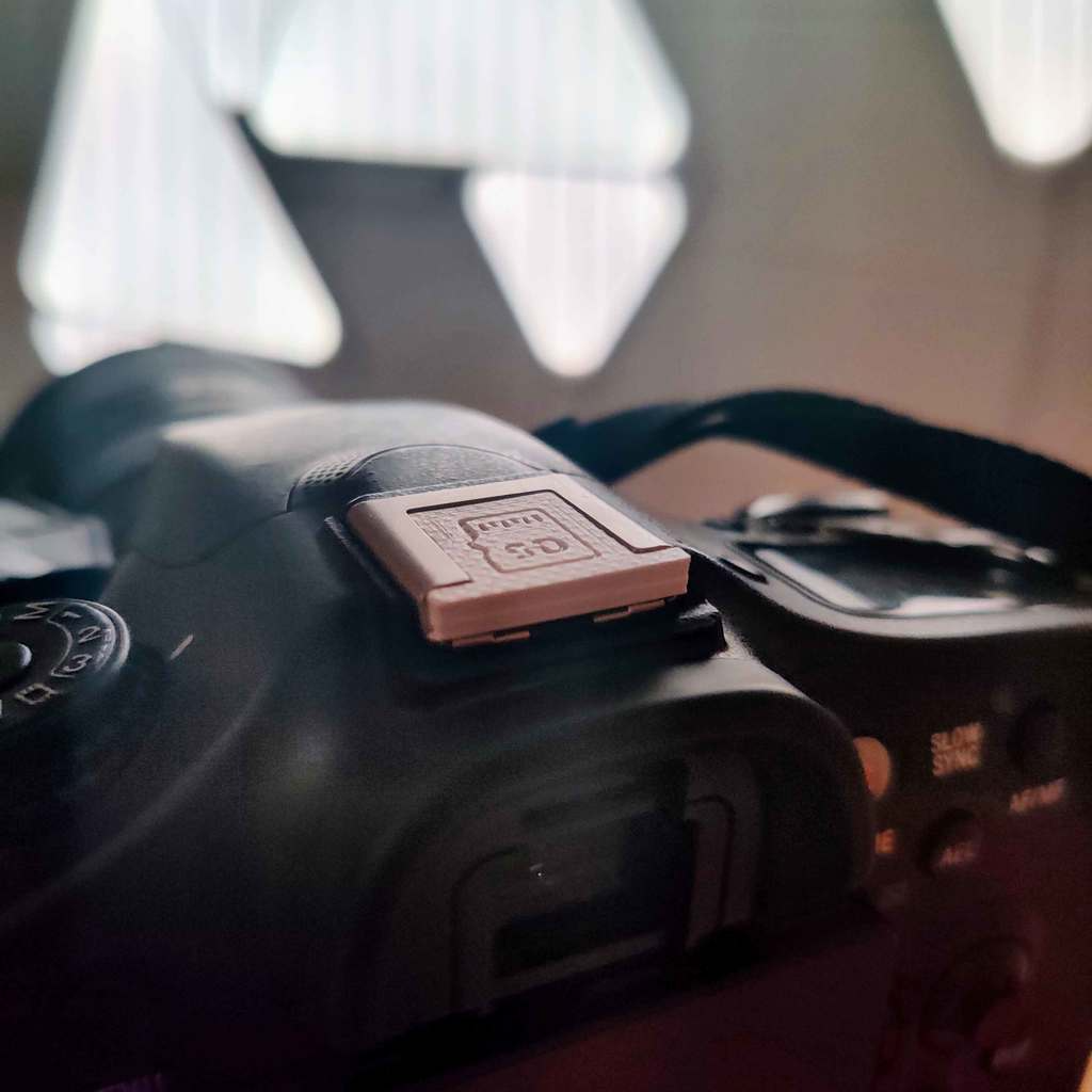 Camera hot shoe with SD card storage