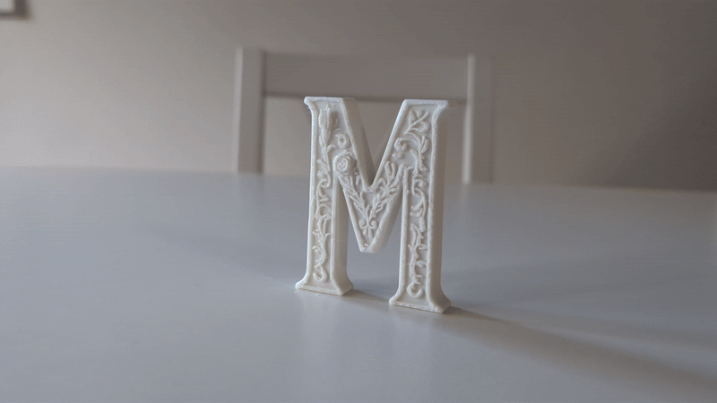 Standing Letter M in a Gypsum Floral Style