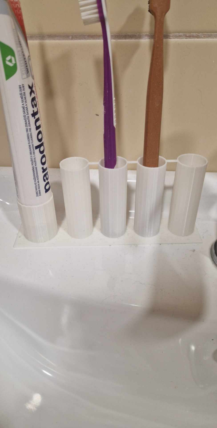 stand for toothbrushes and toothpaste