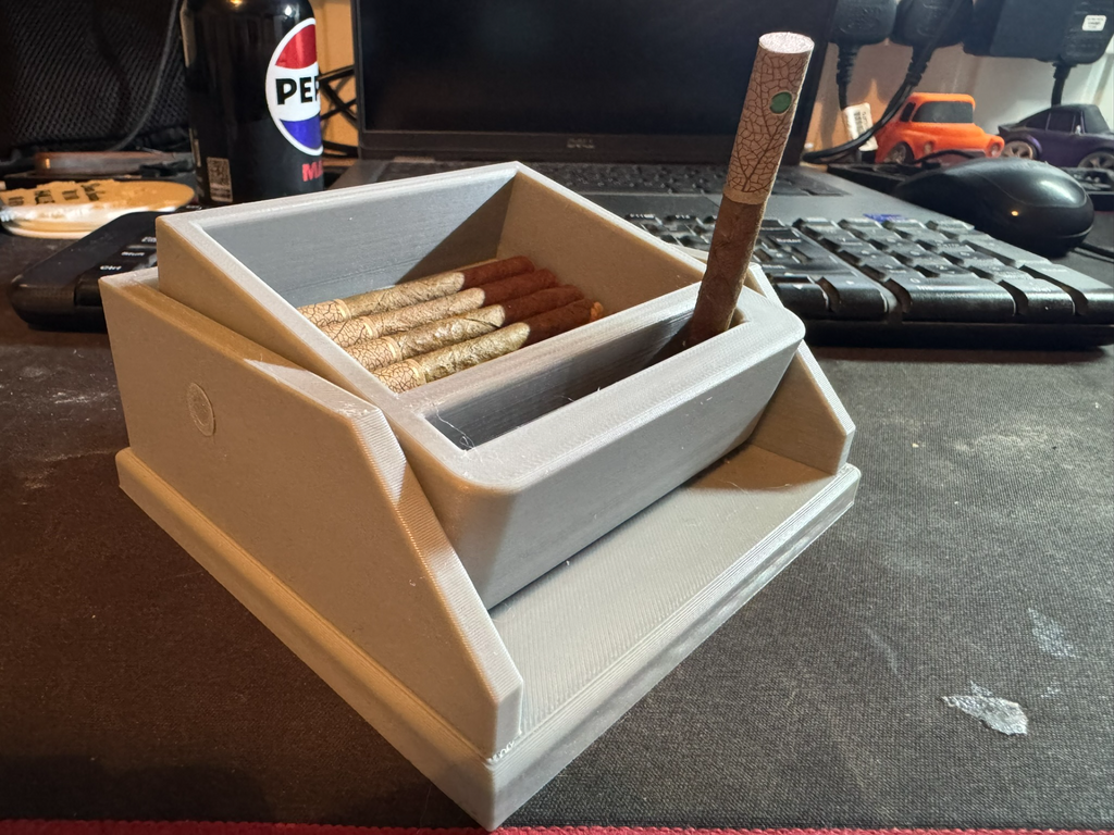 Cigarette box with lift feature