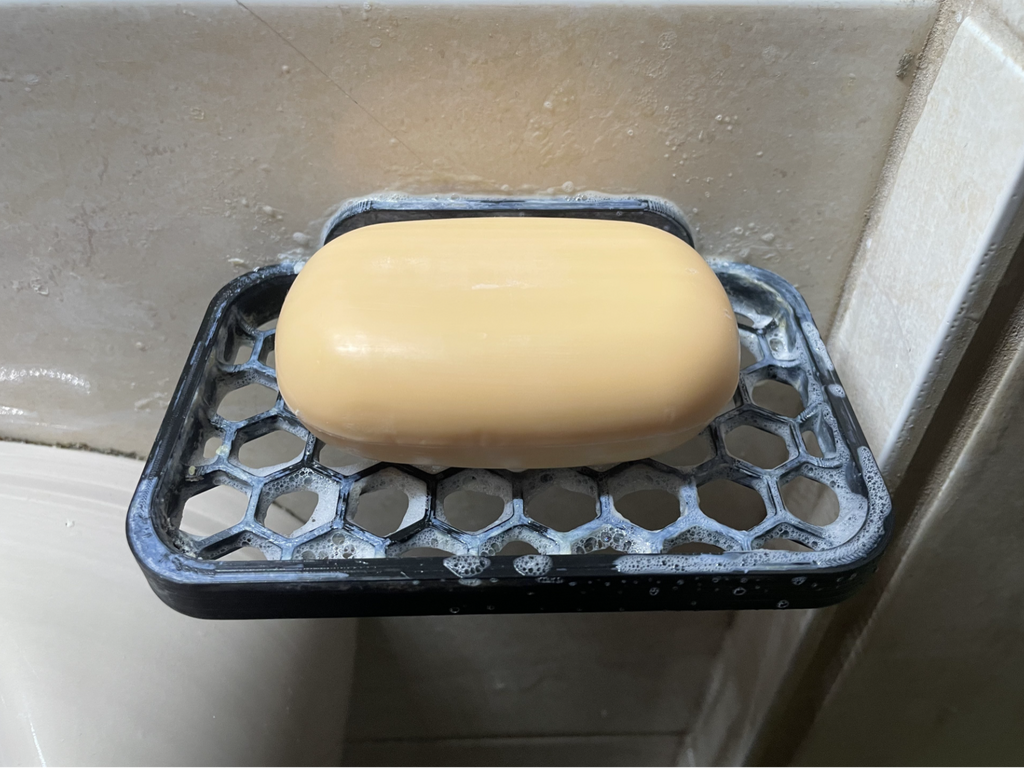 Soap holder with wall mounting hole