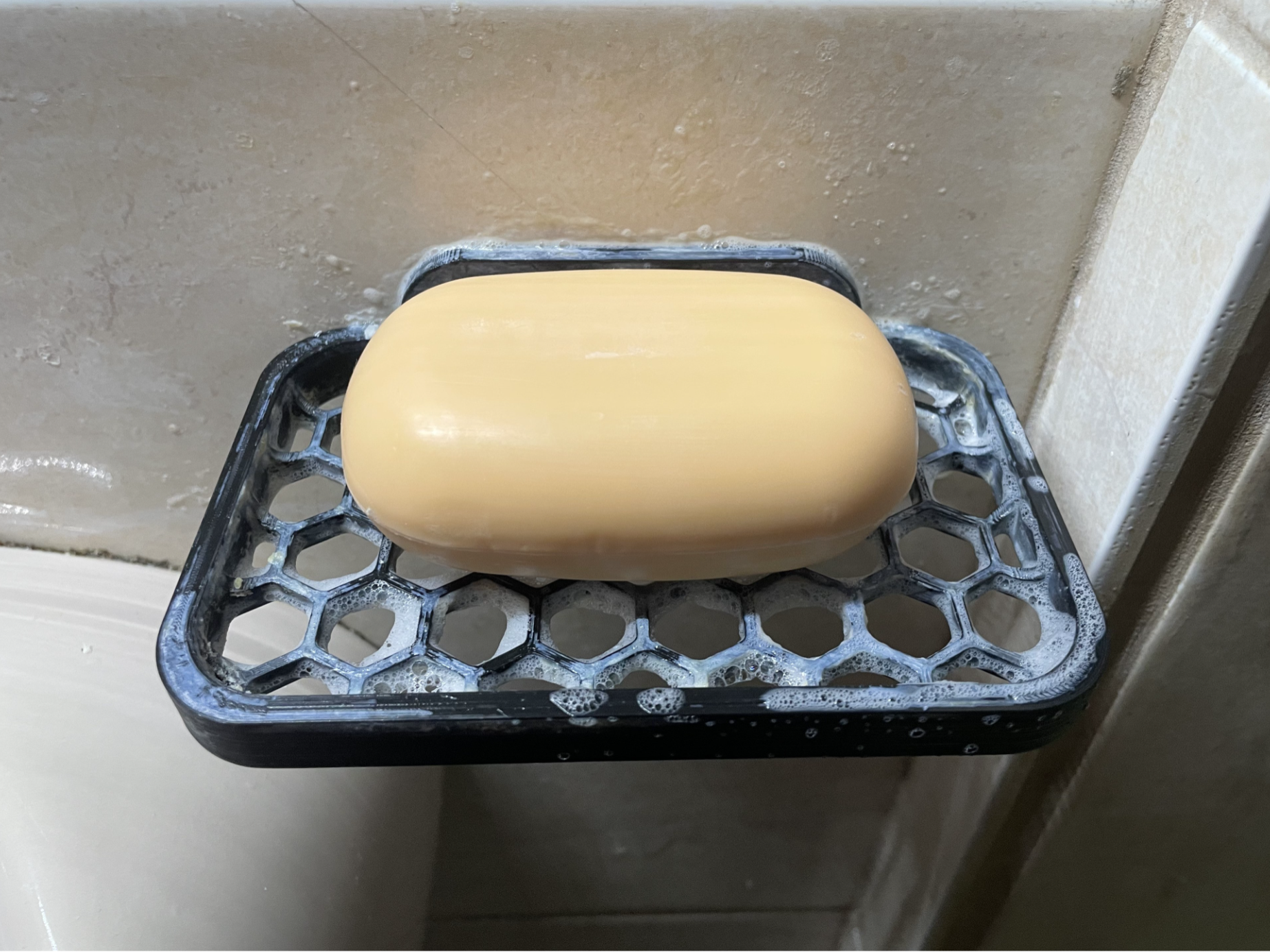 Soap holder with wall mounting hole