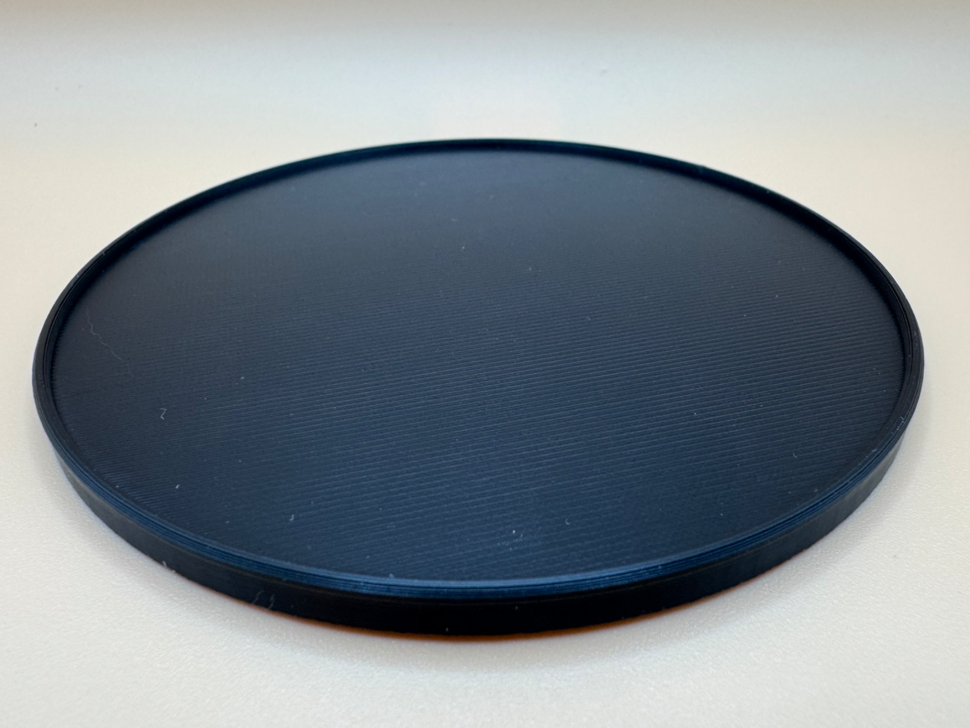 Drink coaster 100x5mm with rim (plain 1 colour)
