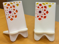 Elegant phone stand with engraved design pattern