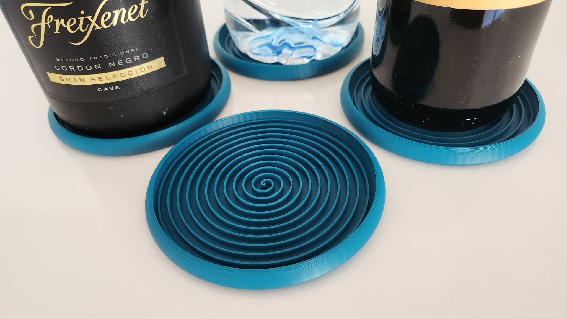 Stackable spiral coaster for large bottles