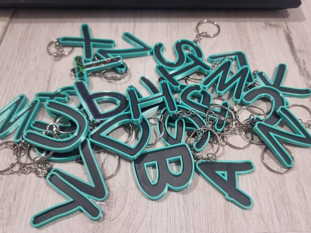 Letters for keychains with raised edge