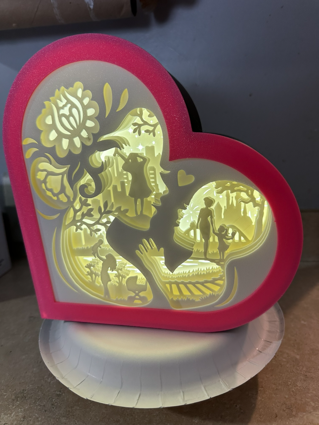 Mother love holding her daughters hand shadow box