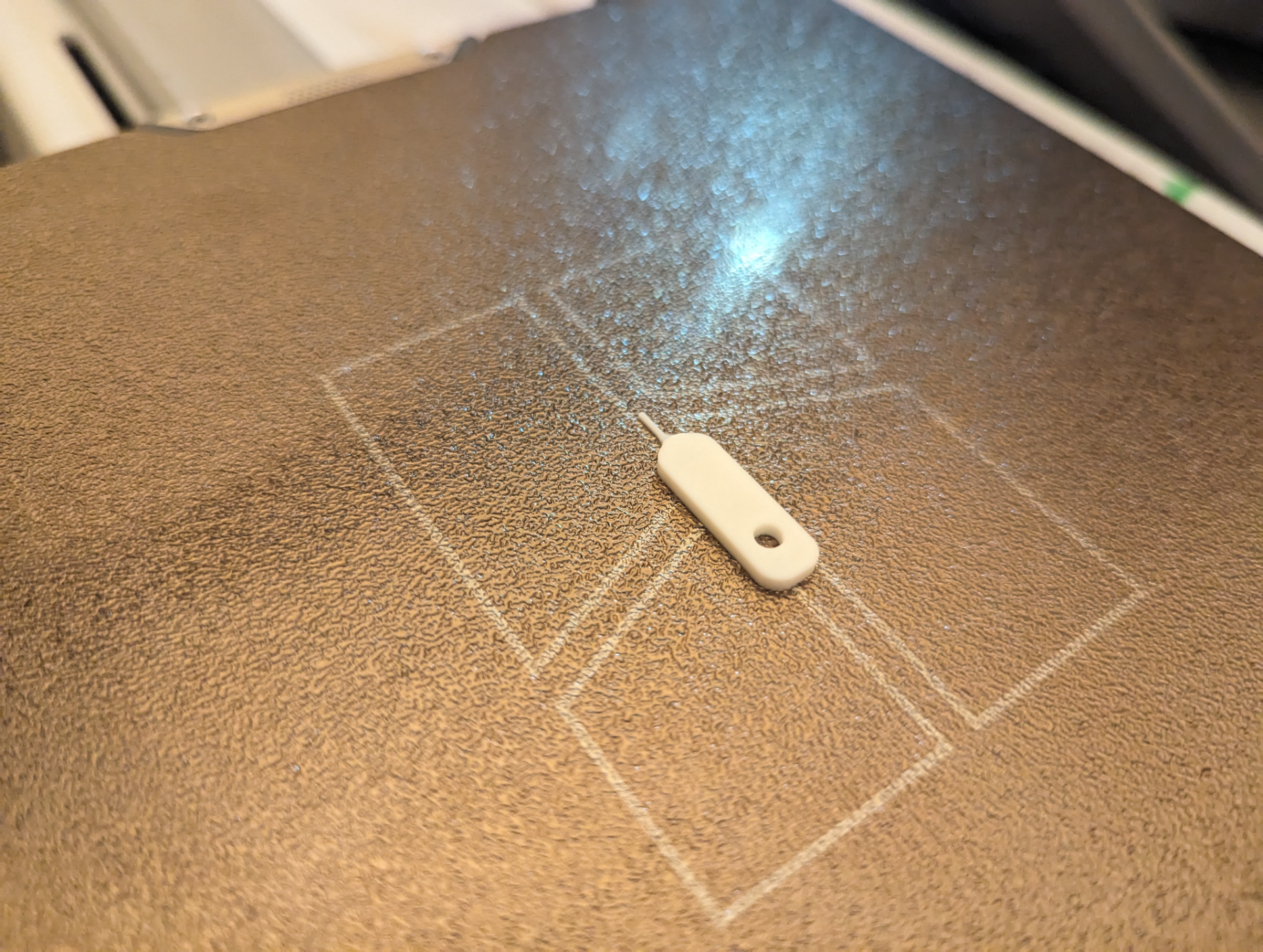 Sim Tray Ejector