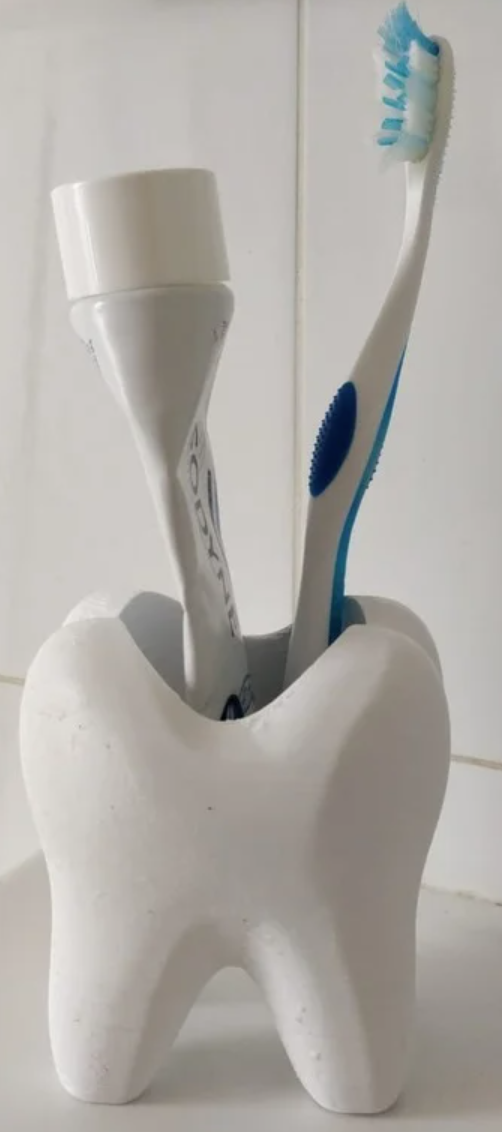 Toothlike holder/cup for bathroom utilities