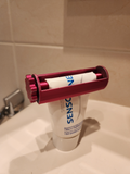 Toothpaste squeezer, roll it up & lock it in place