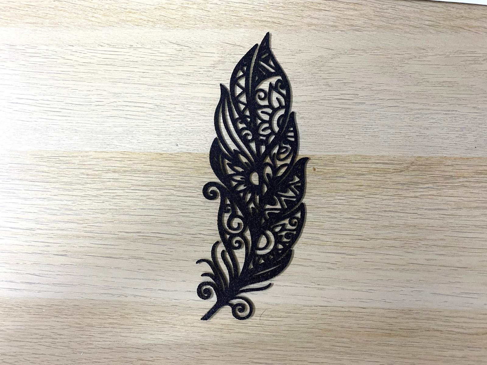 Filigree feather ornament