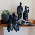A STATUE OF A SITTING GHOST