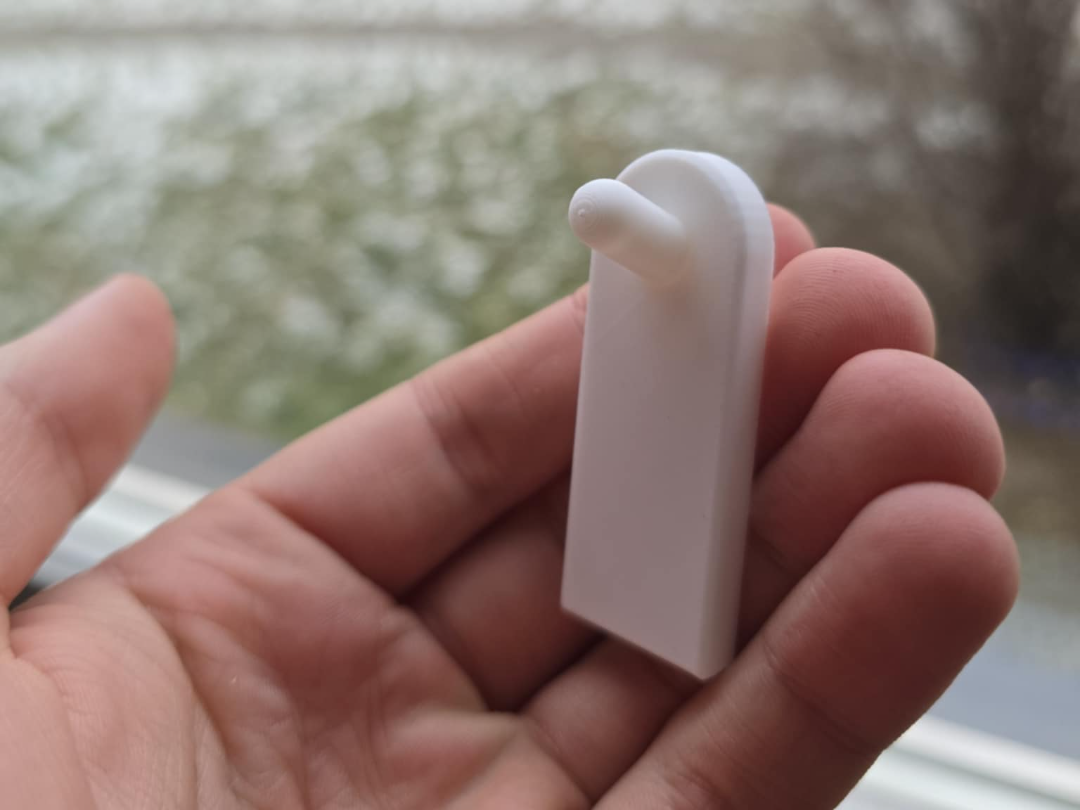 Flush wall hook using adhesive