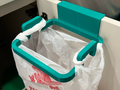 Under sink trash bag holder