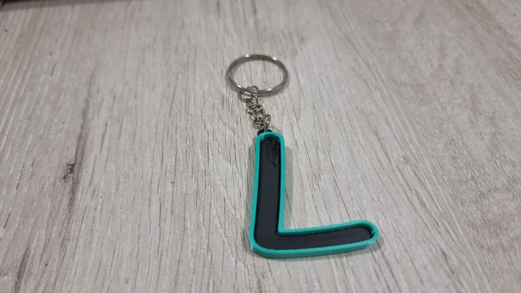 Letters for keychains with raised edge