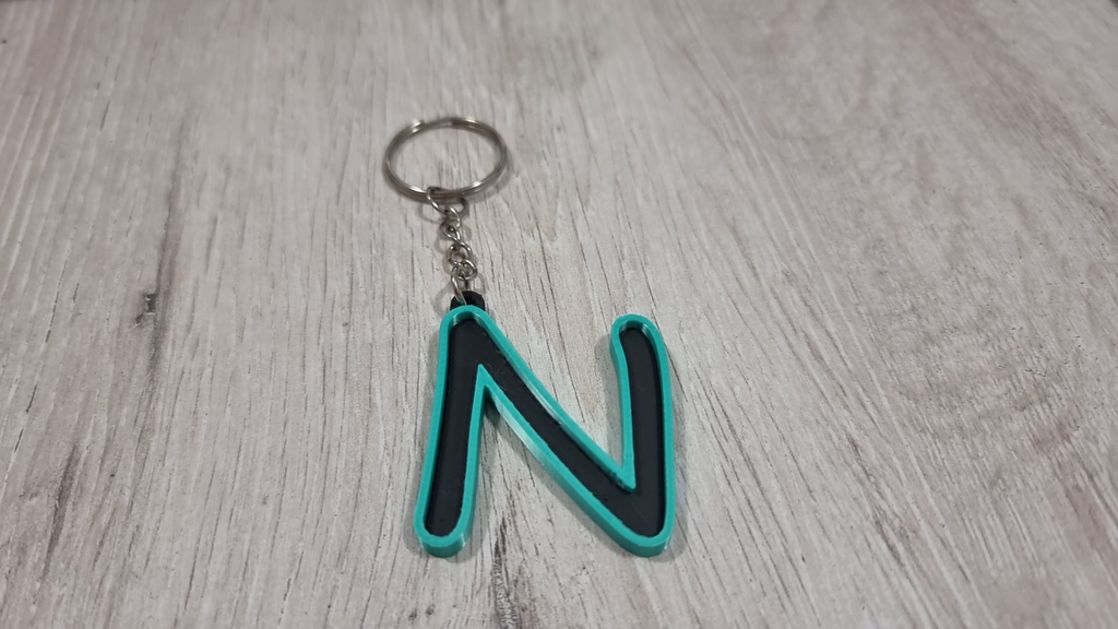 Letters for keychains with raised edge