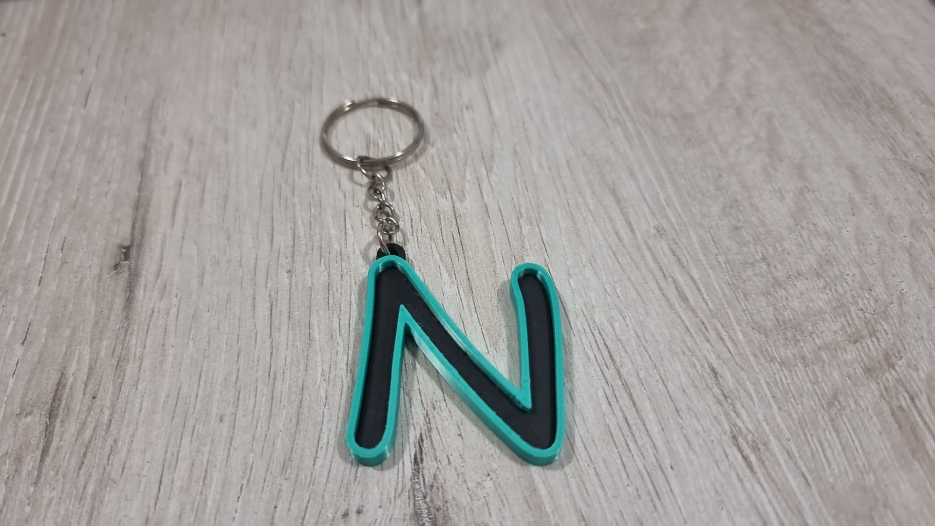 Letters for keychains with raised edge