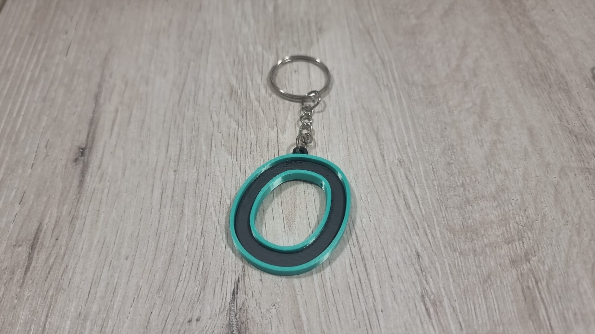 Letters for keychains with raised edge